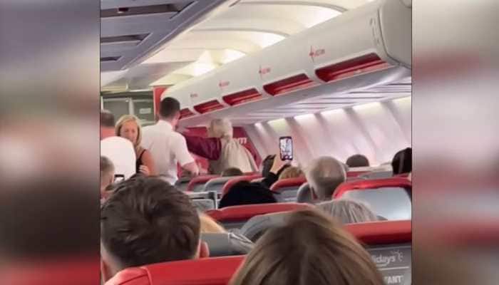 Elderly woman slaps flight crew member mid-air forcing pilot to make emergency landing, video goes VIRAL